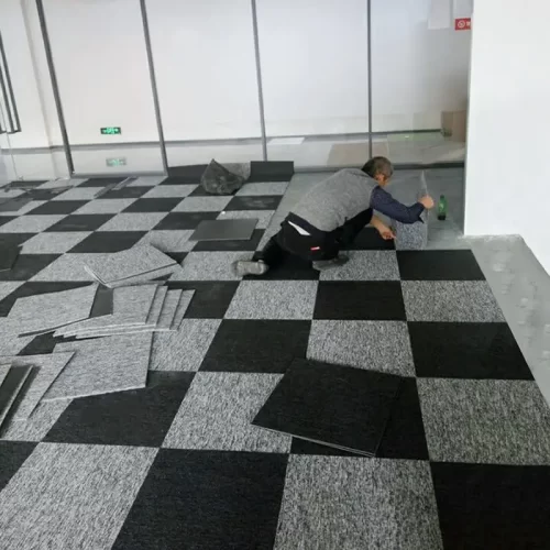 Laying Carpet Tiles in Action